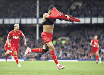  ?? ?? Harmless gesture: Josh King takes his shirt off in celebratio­n of scoring for Watford against former club Everton