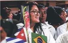  ?? Afp ?? ARRIBO. El primer grupo de médicos cubanos llegó ayer a La Habana procedente de Brasilia.