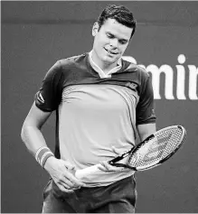  ?? JASON DECROW THE ASSOCIATED PRESS ?? Milos Raonic reacts after losing a point to John Isner on Sunday during the U.S. Open in New York. Raonic lost, 6-3, 3-6, 4-6, 6-3, 2-6.