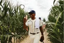  ?? Michael Reaves / Getty Images ?? Starter Marcus Stroman walks through the cornfield before the Cubs faced the Cincinnati Reds on Thursday in Iowa.