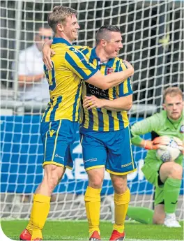  ??  ?? Andy Hunter (left) celebrates Inverurie’s third goal against Turriff