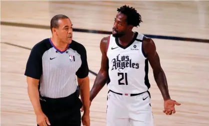  ?? Photograph: Kevin C Cox/USA Today Sports ?? Patrick Beverley of the LA Clippers disputes a foul with referee Curtis Blair during a game against the Phoenix Suns in the NBA bubble.