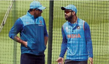  ?? – AP ?? At loggerhead­s: India captain Virat Kohli (right) speaking with head coach Anil Kumble during training for the recently-concluded Champions Trophy at the Oval cricket ground in London on June 7.