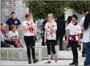  ?? RECORDER PHOTO BY CHIEKO HARA ?? “Zombies” begin strolling around the campus as the sun sets Thursday, Oct. 25, at Harmony Magnet Academy’s Fall Festival.