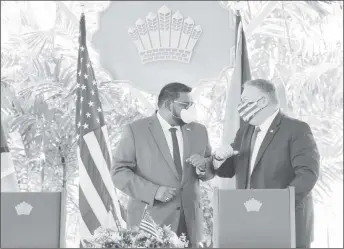  ??  ?? President Irfaan Ali and United States Secretary of State Michael Pompeo exchanging greetings at State House (Office of the President photo)