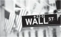  ?? JOHN MOORE/ GETTY IMAGES ?? Five years after the beginning of the financial crisis marked by the bankrupcy of Lehman Brothers, Wall Street has more than recovered its losses, although unemployme­nt in the United States remains high.