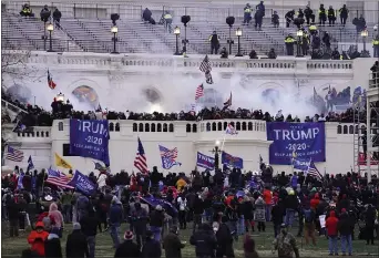  ?? ASSOCIATED PRESS ?? Violent protesters, loyal to President Donald Trump, storm the Capitol on Jan. 6 in Washington.