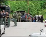  ?? MID-HUDSON NEWS NETWORK ?? Police converge Tuesday near the Mayrbook, N.Y., residence where the suspect was barricaded.