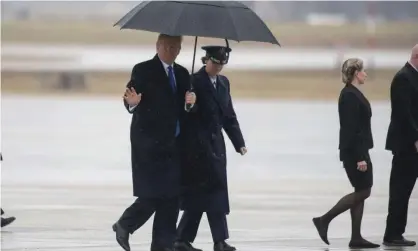  ?? Photograph: Kevin Wolf/AP ?? Donald Trump waves as he walks towards Air Force One on Monday.