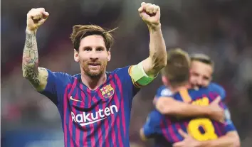  ?? AFP ?? Barcelona’s Lionel Messi celebrates after scoring their third goal during the Champions League Group B match against Tottenham Hotspur at Wembley Stadium on Wednesday.