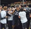  ?? RON CHENOY, USA TODAY SPORTS ?? Fans stormed the court to celebrate guard George King (24) and Colorado’s victory vs. Arizona on Wednesday.