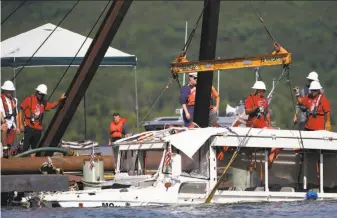  ?? Nathan Papes / Springfiel­d News-Leader ?? A salvage team raises the duck boat that sank near Branson, Mo., killing 17 people. The boat went down Thursday evening after a thundersto­rm generated strong winds and high waves.