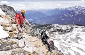  ??  ?? Climbers finish the trek to Whistler Mountain’s summit on the Via Ferrata.