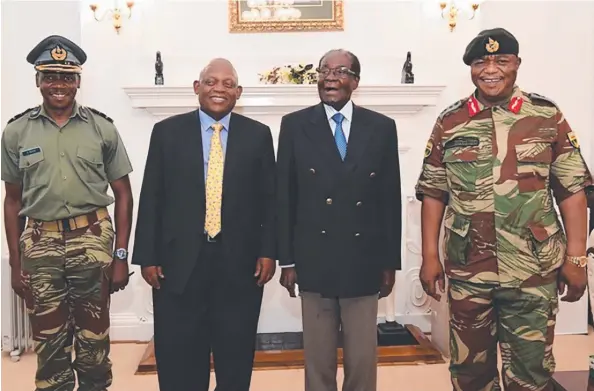  ?? Picture: AFP ?? STANDING FIRM: Zimbabwe President Robert Mugabe (second from right) with Zimbabwe Defence Forces Commander General Constantin­o Chiwenga (right) and South African envoys at State House in Harare. Zimbabwean­s face an uncertain future without Mr Mugabe...