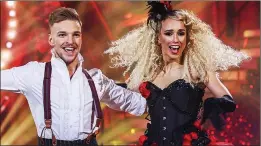  ?? ?? IN STEP: Ervinas Merfeldas with Stephanie Roche on DWTS last night and (below) with his girlfriend Audrey whom he met at gym