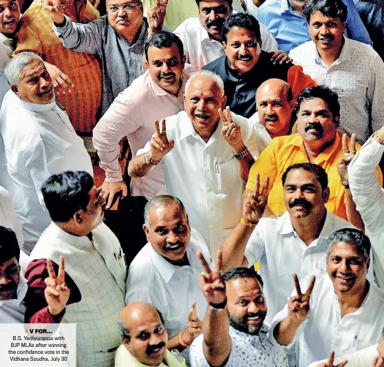  ?? JAGADEESH NV/EPA ?? V FOR... B.S. Yediyurapp­a with BJP MLAs after winning the confidence vote in the Vidhana Soudha, July 30