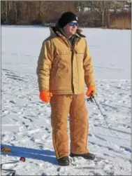  ?? PETE BANNAN – DIGITAL FIRST MEDIA ?? John Young ice fishes at Marsh Creek State Park Tuesday.