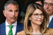  ?? STEVEN SENNE / AP 2019 ?? Actress Lori Loughlin and husband clothing designer Mossimo Giannulli pleaded guilty in May. Loughlin was ordered to serve two months behind bars while Giannulli was sentenced to five months after they admitted to paying bribes to get their two daughters into the University of Southern California.