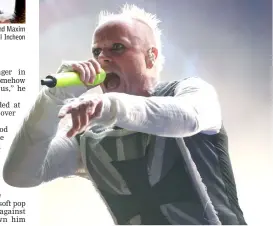  ??  ?? File photo taken on Aug 13, 2015 shows members of the British band The Prodigy, Liam Howlett (right), Keith Flint (centre), and Maxim (left) posing prior to an interview in Tokyo. - Keith Flint died at the age of 49 and (right) Flint performs at the 10th annual Incheon Pentaport Rock Festival in Incheon, west of Seoul on Aug 9, 2015. — AFP photos