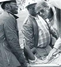  ?? Picture: MBUZENI ZULU ?? CONCERNED: Butler checks on one of his players, Donald Khuse, as first-aid assistants carry him off the field