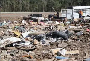  ?? The Sentinel-Record/Richard Rasmussen ?? LANDFILL: People dump their trash at the Garland County Landfill on Tuesday.