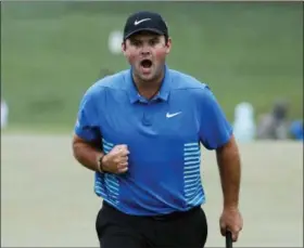  ?? DAVID GOLDMAN — THE ASSOCIATED PRESS ?? Patrick Reed reacts after making a birdie putt on the ninth hole during the third round at the Masters golf tournament Saturday in Augusta, Ga.