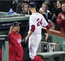  ?? ELISE AMENDOLA — THE ASSOCIATED PRESS ?? Boston manager Alex Cora, left, gives starting pitcher David Price a hand in the sixth inning in Game 2 Wednesday in Boston.