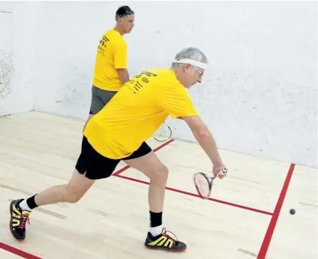  ?? CLIFFORD SKARSTEDT/EXAMINER ?? Players Doug Edmondson returns against George Gill during the 5th annual PSB Wilson Squash Classic on Saturday at the Peterborou­gh Squash Club.