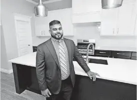  ?? [PHOTO BY NATE BILLINGS, THE OKLAHOMAN] ?? Prinston Wilson of Legacy Constructi­on &amp; Developmen­t shows part of the kitchen at 2525 Shady Hollow Drive in Choctaw, an entry in the Parade of Homes Fall Classic, which continues from 1 to 7 p.m. Saturday and Sunday across the Oklahoma City area.