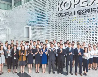  ?? Courtesy of KOTRA ?? Korea Trade Investment Promotion Agency (KOTRA) employees applaud in front of the Korea Pavilion at Expo 2017 Astana.