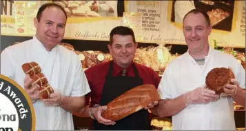  ??  ?? At Joanne’s Cafe, Main Street, Gorey, Staffords Bakeries celebrate winning seven Blas Na hEireann awards: Richard Donohoe, fresh cream manager; Pat Kelly, Joanne’s Cafe manager; and Jason Wilson, confection­ery manager.