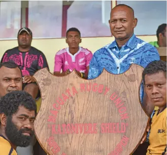  ?? Photo: Laisa Lui ?? Macuata Rugby games chairman Nat Ledu presents the Katonivere Shield at Subrail Park, Labasa.