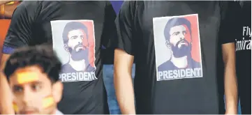  ??  ?? Spain’s supporters wear t-shirts depicting player Gerard Pique as president during the Russia 2018 FIFA World Cup Group G qualifying match between Israel and Spain at Teddy Stadium in Jerusalem, in this Oct 9 file photo. — AFP photo