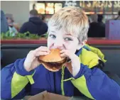  ?? BRYAN BENNETT, AP ?? Arby’s offers venison sandwiches during hunting season, as Aedan Speedy, 8, of Richland, Mich., found out last November.