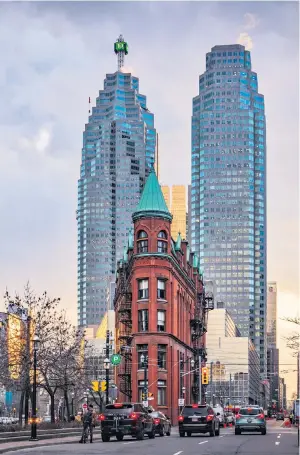  ??  ?? iToronto’s Gooderham Building is also known as the Flatiron Building. And, yes, there is a similar one in New York