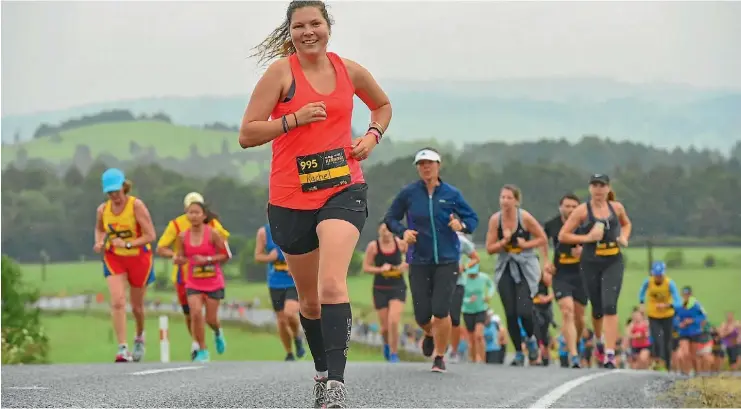  ??  ?? Rachel Yuretich from Kaitaia strides out around the 7km mark.