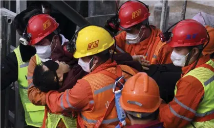  ?? Photograph: Chen Hao/AP ?? A survivor of the disaster in Qixia City in China’s Shandong province is taken to hospital after rescue. Ten miners died.