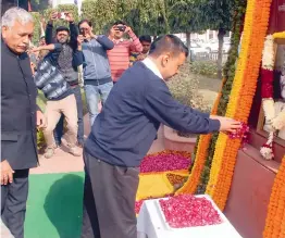  ?? — PTI ?? Delhi chief minister Arvind Kejriwal pays tributes to Dr Bhim Rao Ambedkar on ‘ Mahaparini­rvan Diwas’ at Vidhan Sabha in New Delhi on Wednesday.