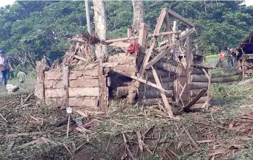  ?? — AFP photo ?? A destroyed structure is seen at the site of an explosion at Barangay Maganda on the outskirts of Lamitan city on the southern island of Mindanao.