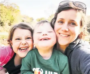  ??  ?? Kristin Birkett with son Gwilym, centre, and daughter Klara