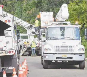  ?? Matthew Brown / Hearst Connecticu­t Media ?? A utility crew works to erect a downed pole Aug. 7 in Stamford.