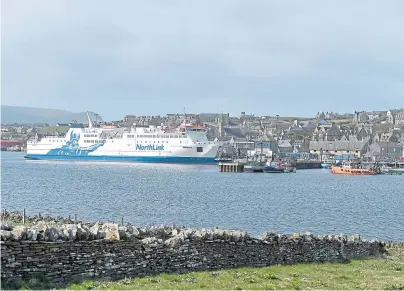  ?? Photograph by Sandy McCook ?? DEAL: The Hamnavoe alongside the harbour at Stromness in Orkney.