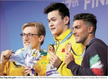  ??  ?? Sun Yang wins gold in men’s 400m freestyle at the 17th FINA World Aquatics Championsh­ips in Budapest, Hungary on Sunday. Mack Horton of Britain won silver and Gabriele Detti of Italy was third. Sun Yang wins gold in men’s 400m freestyle at the 17th...