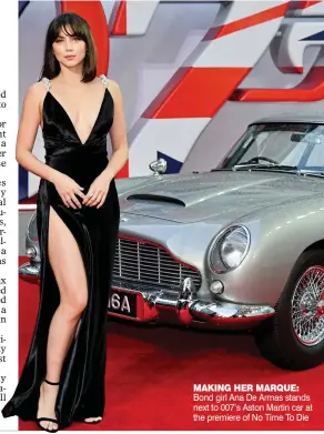  ?? ?? MAKiNG HeR MARQue: Bond girl Ana De Armas stands next to 007’s Aston Martin car at the premiere of No Time To Die