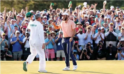  ?? Scott.Photograph: Jamie Squire/Getty Images ?? Scottie Scheffler celebrates winning the Masters for the second time with his caddie Ted