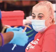  ?? Erik Trautmann / Hearst Connecticu­t Media ?? Stew Leonard’s employee Adrianna Hormel receives a shot during the Griffin Hospital COVID-19 vaccinatio­n clinic at the Norwalk store last month.