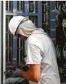  ?? Michael Ciaglo / Houston Chronicle file ?? A CenterPoin­t Energy tech works at a substation.