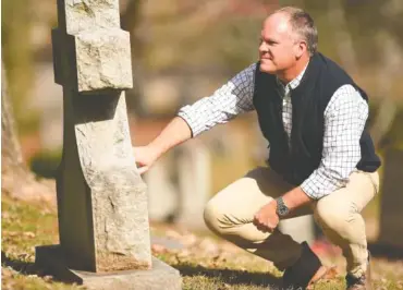  ?? STAFF PHOTO BY MATT HAMILTON ?? David Magee visits the grave of his son William in Forest Hills Cemetery on Nov. 8 during a visit to Chattanoog­a.