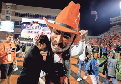  ?? SARAH PHIPPS/THE OKLAHOMAN ?? Fortifying the Big 12 might be the best play for Pistol Pete and Oklahoma State. The Big 12 remnants have pledged their bond, but they know if Power 5 leagues come calling, the answer will be yes.