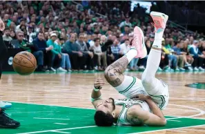  ?? (AP Photo/charles Krupa) ?? Boston Celtics forward Jayson Tatum reacts on the floor Friday during the second half of Game 2 of the NBA basketball playoffs Eastern Conference finals against the Miami Heat in Boston.